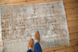 Distressed vintage Karaja Hamadan rug showing wear to foundation and geometric designs.