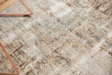 Distressed Hamadan rug pile revealing foundation, geometric patterns, antique ivory, chocolate brown, pale blue.