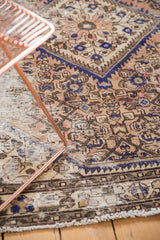 Textured distressed Hamadan rug with worn herati motif and blues, blush, sand.