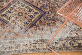 Vintage Distressed Hamadan rug's worn pile, exposed foundation, and cobalt herati motif.