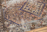 Sharply serrated medallion edge and distressed herati motif with exposed foundation.