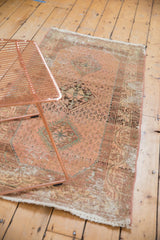 Distressed vintage Hamadan runner showing mostly even wear to knot heads and faded rose colors.