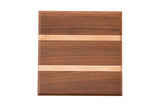 Small square mahogany and maple serving board with two light wood stripes.