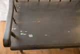 Antique Deacon's Bench seat, dark paint distressed with green chips and fine crackle.