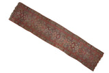 Repeating diamond medallions and red-orange border on an antique Kurdish runner, featuring light end loss.