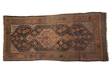 Antique Kamseh hand knotted runner rug with geometric scale design, copper and dark blue.