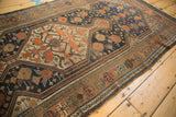 Antique Kamseh runner border section, showing copper, aubergine, and dark blue motifs.