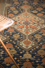 Harmonious wooded shades define this antique Persian Kamseh runner's distinctive scale design motif.