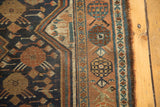 Antique Kamseh runner's intricate border, detailed with scale motifs in copper, blue, and ivory.