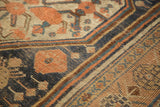 Antique Kamseh hand-knotted pile, geometric scale motif in copper, dark blue, and antique ivory.
