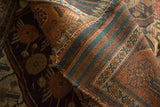Hand-knotted antique Kamseh rug runner's secure edge and tightly woven back in copper and blue.