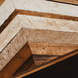 Textured reclaimed wood art, varied brown and off-white chevron pattern.