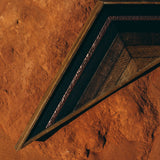 Detail of Huntleigh Dusk triangular art, highlighting alternating dark woods and textured copper.