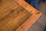 Corner detail of reclaimed wood planks with riveted copper edging.