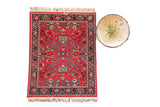 Bijar Deep Red Mouse Pad with allover Heriz floral pattern, black border, and white fringe, 7x9 inches.