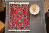 Vibrant Bijar Heriz MouseRug featuring a deep ruby red field and intricate floral pattern.