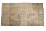 Vintage Oushak carpet, large medallion, stepped floral designs, soft beige and apricot abrash tones.