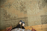 Vintage Oushak rug detail with stepped contours, floral cross-sections, and beige abrash.