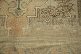 Vintage Oushak rug pile with abrash, pale apricot, beige, and contoured floral motifs.