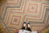 Dynamic stepped diamond pattern of vintage Turkish Jijim rug in black cherry, ivory, and beige.