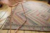 Vintage Turkish Jijim flatweave rug with stepped, concentric diamond motifs in red, ivory, forest green.