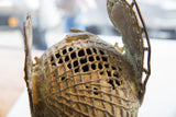 Detailed openwork casting and aged bronze patina on the vintage African prince head.