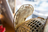 Aged patina and textured surface on an ornate detail of the Benin bronze sculpture.