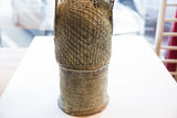 Detailed textural patterns on the back of the vintage Benin bronze head sculpture.