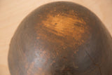 Aged wood surface of vintage African bowl displaying character from a deep crack.