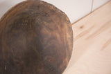 Rustic texture and dark wood grain on the hand-carved vintage African bowl.