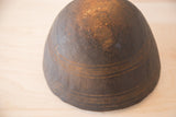Dark wood texture and hand-carved horizontal lines on the vintage African bowl's lower body.