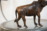 Detailed hindquarters and aged copper texture of the vintage African wildebeest sculpture.