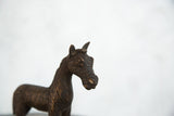Textured copper African zebra sculpture close-up, highlighting the detailed head and striped body.