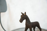 Vintage African copper zebra sculpture's carved head, neck, and striped body.