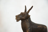 Vintage African copper topi sculpture, textured with aged patina.
