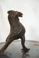 Textured body and wing detail of the vintage copper African bird sculpture.