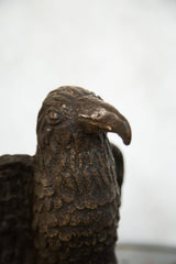 Textured copper feathers with aged patina on the African eagle sculpture.