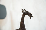 Detailed profile of the vintage African copper giraffe sculpture's head.