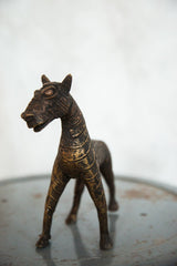 Detailed copper head and textured neck of the vintage African zebra sculpture.