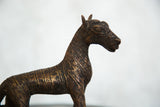 Aged copper patina and striated texture of the African zebra sculpture's head.
