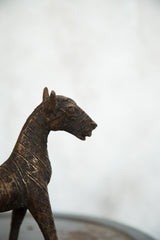 Vintage copper African zebra sculpture, close-up of detailed head and striped neck.