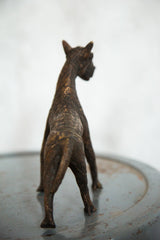 Vintage African copper zebra sculpture from the back, showing ribbed texture.