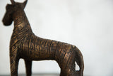 Vintage African copper zebra with textured, banded body and rich, antiqued finish.