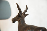 Vintage African copper antelope sculpture head with twisted horns and rich patina.