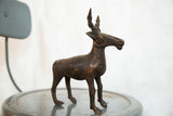 Patinated copper body and slender front legs of the vintage African antelope sculpture.