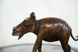 Side view of the vintage African copper hippo sculpture, showing detailed texture and rich patina.