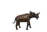 Detailed vintage African copper rhino sculpture with rich, aged patina, 8 inches tall.