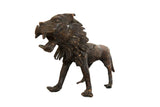 Vintage African copper lion sculpture roaring, with detailed mane and rich aged patina.