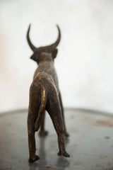 Vintage copper African buffalo sculpture, rear view with textured dark finish and gold patina.
