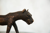 Vintage African copper tiger sculpture's head with etched detail and rich, aged patina.